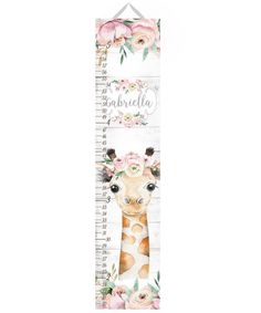 a tall growth ruler with a giraffe and flowers on it's face