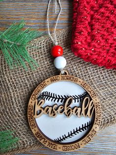 a baseball ornament hanging from a christmas tree