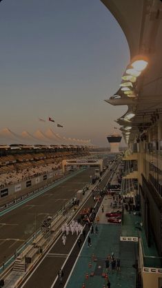 an aerial view of a race track at sunset