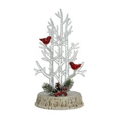 two red birds perched on top of a white tree