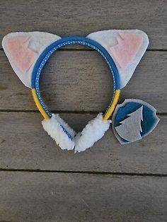 the headband is made out of felt and has an arrow on it