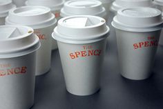 there are many cups with lids on each one and the words spencer written on them