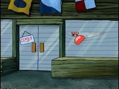 an image of a store front with flags hanging from the roof and on the door