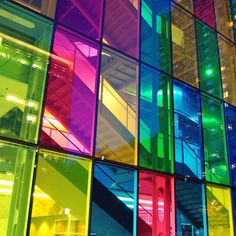 multicolored glass building with stairs and windows