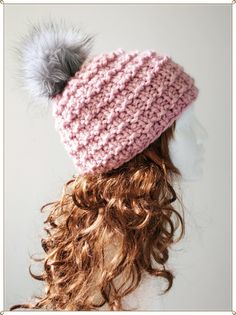 a knitted hat with a pom - pom on top