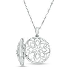 Make a clever statement of fashion with this enchanting diamond locket. Crafted in sterling silver, this mesmerizing style showcases an open-worked floral design of layered petal shapes centered with a sparkling bezel-set diamond. Dainty diamonds adorn the border for added shimmer. The final touch: the hinged choice opens to reveal space for two small photos or other mementos. Radiant with 1/8 ct. t.w. of diamonds and a bright polished shine, this locket suspends along an 18.0-inch rope chain th Elegant Locket Necklace With Flower Charm Round Pendant, Elegant Locket Necklace With Flower Charm, Elegant Round Pendant Locket Necklace With Flower Charm, Elegant Flower Charm Locket Necklace, Fine Jewelry White Gold Locket, Elegant Flower Pendant Locket Necklace, Elegant Silver Locket Necklace, Elegant Jewelry With Flower Pendant Locket, Elegant Pendant Locket Necklace With Flower Charm