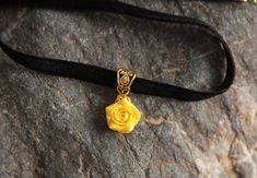 "Black  velvet ribbon choker with sculpted yellow sparkle rose. Material of rose is polymer clay with special cover Each petal of flower made by hand Dia flower about 15 mm/ 0.55 \" Length of necklace is adjustable:  10-12 inches/ 25,4 - 30,5 cm 11-13 inches/ 28-33 cm 12-14 inches/ 30.5- 35.5 cm 13-15 inches/ 33-38 cm 14-16 inches/ 35.5 cm-40.5 cm 15-17 inches/ 38,1 cm- 43,2 cm 16-18 inches/ 40.6 cm- 45.7 cm 17-19 inches/ 43 cm - 48 cm 18-20 inches/ 45,5- 50.8 cm Width of ribbon 10 mm / 0.4 inch If you need other length of necklace let me know and I will make it for you. Polymer clay isn't afraid of water, strong and non-toxic. Gorgeous gift for women and girls as handmade item ALL CHOKERS - https://www.etsy.com/shop/BuduartJewelry?ref=simple-shop-header-name&listing_id=694544029§ion_id=22 Adjustable Flower Pendant Choker For Gift, Adjustable Flower Pendant Choker Gift, Gift Flower Pendant Adjustable Choker, Elegant Yellow Choker As A Gift, Elegant Yellow Choker For Gifts, Gold Flower Choker As Gift, Adjustable Rose Design Choker Necklace, Rose Design Choker Jewelry Gift, Rose Design Choker Jewelry For Gift