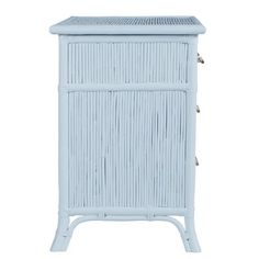 a white cabinet with wicker doors and drawers on the bottom, against a white background