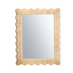 a square mirror with scalloped edges on a white wall, in the shape of a shell