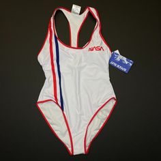 Women's Undercurrent Nasa Americana Racerback One-Piece Swimsuit. Brand New With Tags. Features: - Color: White - Style #: Na0014-12 - Removable Bra Cups - Racerback - Scoopneck - Hand Wash - Polyester & Spandex Material White Racerback Bodysuit For Summer, White Fitted Racerback Swimwear, White Racerback Swimwear For Summer, White Racerback Swimwear For Beach Season, Nasa Space Suit, Space Suit, Bra Cups, White Style, Womens Swim