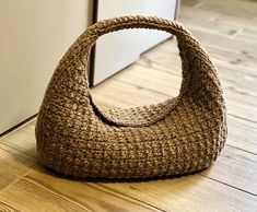 a brown bag sitting on top of a wooden floor