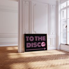 there is a sign that says to the disco in front of a window with white walls