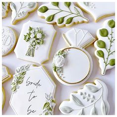 wedding cookies decorated with white and green decorations