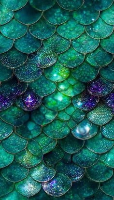 green and purple scales with drops of water on them, as if they were made out of