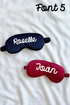 three different colored eye masks laying on top of a white sheet with the word font 5