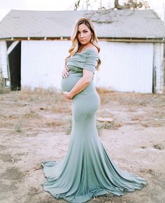 This Sexy Mama Maternity Ruched Fold Over Flare Gown is the perfect photoshoot or special event maternity gown! With a slim fit bodice, a simple flare, and a premium stretch material this gown is equal parts comfort and elegance. This formal maternity dress is sure to wow!   #SexyMamaMaternity #maternitygown #maternitydress #maternityphotography #maternityphotoshoot #maternitypictures #maternityposes #bestmaternity Maternity Stretch Maxi Dress, Stretch Maternity Maxi Dress, Fitted Maxi Maternity Dress, Fitted Maxi Length Maternity Dress, Fitted Maternity Dresses Bump Friendly, Bump Friendly Maternity Maxi Dress, Bump Friendly Maxi Maternity Dress, Maternity Dresses With Sweep Train, Fitted Maternity Dress With Sweep Train