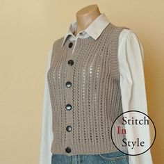 a mannequin wearing a sweater vest with buttons on the front and sleeves down