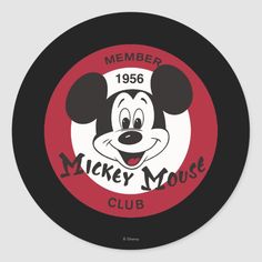 the mickey mouse club logo is shown in red and white with black lettering on it