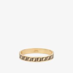 Rigid bracelet with FF motif. Spring fastening. Made of gold-finish metal. Enamelled in shades of black. Made in Italy. Size L Fendi Ring, Fendi Earrings, Fendi Logo Design, Fendi Bracelet, Wedding Ring Tattoo, Fendi Store, Fendi Jewelry, Girly Jewelry, Dream Jewelry