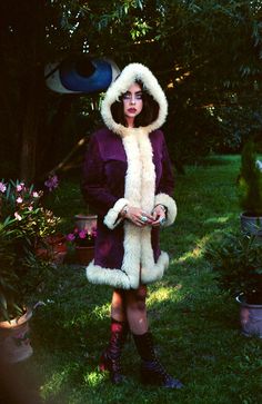 These are so rare to find from this era  This beauty is made from genuine purple suede with real curly lamb shearling trim. It has hood & front hooks.  So extremely beautiful & rare ICONIC vintage collectable 1960's / 1970's shearling sheepskin coat!  ⫸True Vintage! 60's 70's WOODSTOCK Era. Made in London/England ⫸ Very unique style with real  sheep fur! ⫸ AMAZING timeless design ⫸  This warm & snuggly beauty is sure to be the star of your wardrobe! ⫸ Condition: This is a VINTAGE Item, a true wo Bohemian Winter Costume Outerwear, Hippie-style Fitted Winter Outerwear, Hippie Style Fitted Winter Outerwear, Fitted Hippie Winter Outerwear, Fitted Hippie Outerwear For Winter, Vintage Hooded Fur Coat For Fall, Retro Winter Festival Outerwear, Vintage Winter Costume Outerwear, Afghan Coat