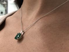 Featured here is a stunning oval emerald necklace in fine .925 sterling silver. Displayed in the center is a rich-green emerald accented by a floral four-prong silver mount, allowing for the emerald to be shown in full view. Minor flaws are normal and add to the beauty of this earthy piece. The earth mined, green Colombian emerald has a desirable lush green color with excellent qualities. An 18-inch sterling silver chain will be provided with this beautiful pendant! This necklace is ideal for ev Oval Emerald Gemstones With Accents, Oval Hallmarked Emerald Necklace Gift, Silver Emerald Necklace With Oval Pendant For Formal Events, Classic Oval Emerald Sterling Silver Necklace, Silver Emerald Necklace With Oval Pendant For Formal Occasions, Oval Emerald Sterling Silver Necklace, Classic Oval Emerald Necklace In Sterling Silver, Oval Emerald Gemstone Necklace In Sterling Silver, Elegant Oval Emerald Necklace With Natural Stones