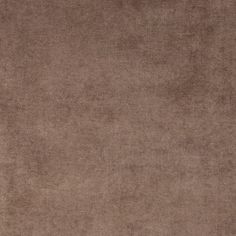 an area rug with a brown background