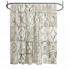 a shower curtain with an abstract design on the front and back panels, hanging from a metal rod