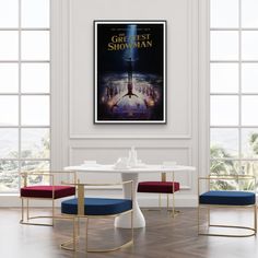 a movie poster hanging on the wall above a dining room table with two chairs in front of it