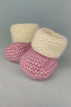 These hand knitted baby booties made of a soft hypoallergenic baby yarn (60% cotton, 20% merino wool 20% acrylic). This baby yarn is perfect for sensitive skin. Not itchy. Size: Newborn 3.25 inches/8 cm). The booties are hand knitted with love and care for your children. I believe that your children will feel it! Knitted newborn shoes an ideal baby shower gift or newborn baby gift. Care: hand wash at 40 degrees. Dry flat. Cute Pink Booties As Gift, Cute Pink Booties For Gift, Cute Pink Handmade Booties, Cute Handmade Pink Booties, White Knitted Winter Booties, White Knitted Booties For Winter, White Winter Booties As A Gift, White Winter Booties As Gift, Comfortable Soft White Booties