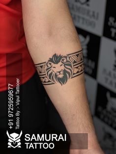 a man's arm with a tattoo on it that has a lion head in the middle