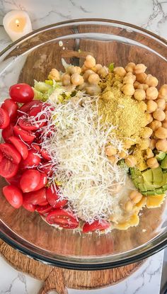 a glass bowl filled with different types of vegetables