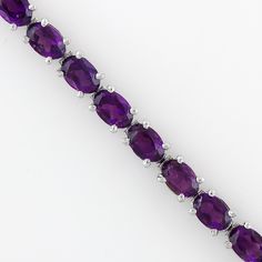 Step into the world of elegance and mystique with our Natural African Amethyst Bracelet. This exquisite piece of jewelry is more than just an accessory, it's a statement. Handcrafted with love and precision, this bracelet is a perfect gift for your wife or a treat for yourself. Key Features: Authentic African Amethyst: Sourced from the heart of Africa, the amethyst in this bracelet carries a rich history and a unique charm that sets it apart. Healing Gemstone: Known for its healing properties, t Classic Amethyst Bracelets, Amethyst Tennis Bracelet As A Gift, Classic Amethyst Bracelets In Purple, Purple Gemstone Tennis Bracelet, Classic Amethyst Purple Bracelets, Purple Gemstone Round Tennis Bracelet, Classic Purple Amethyst Bracelets, Purple Round Tennis Bracelet For Formal Occasions, Elegant Round Amethyst Crystal Bracelet