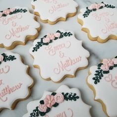 decorated cookies with names and flowers on them