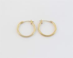 "Offering here is a pair of fabulous 14k yellow gold hoop earrings!! Purity : 14k yellow gold, Tested and stamped Measurements : 5/8\" in diameter or 17 mm wide by 1.5 mm thick. Closure: Hinged post and omega catch. Weight: 0.6 gram Complementary Gift Box These earrings are about the same size as a dime. Images may be enlarges to show details.Please pay attention to the photos and read description before the purchase. I ask you earnestly to make sure about measurements such as size , thickness, 14k Yellow Gold Huggie Hoop Earrings, Yellow Gold 14k Huggie Hoop Earrings, Classic Yellow Gold Hoop Earrings Stamped 14k, Classic 14k Huggie Hoop Earrings, Engraved Locket, Gold Heart Locket, Heart Locket, Male And Female, Jewelry Earrings Hoops