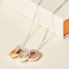 Treasure the bonds of an everlasting love with our Personalized Unity Trio Necklace. Each disc, as unique as its chosen metal, shines with individuality. Create a necklace to cherish by choosing the names and dates closest to their heart to discreetly engrave onto each charm.&nbsp;18K Champagne Gold Plated, 925 Sterling Silver and 18K Rose Gold platedUnity charm size: Diameter 0.5 and Thickness 0.1Hand engraved in our Paris workshopSent with love in a complimentary gift boxAny slight variati Trio Necklace, Everlasting Love, Champagne Gold, Personalized Necklace, Hand Engraving, 18k Rose Gold, Rose Gold Plates, Or Rose, Metallica