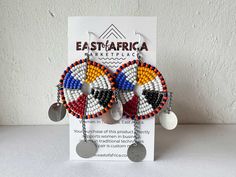 Direct trade and ethically sourced hand beaded earrings from Maasai Women in Tanzania, East Africa. Your purchase of this product directly supports Maasai Mama's with micro-businesses, invests in supporting tradition, and each pair is custom made. We are committed to partnership and trading with the same Maasai Mama's, and we return regularly as customers to our producers in Northern Tanzania via their family store in Zanzibar. Each pair of earrings come in a handmade African Wax Print gift bag. Masai Earrings, Masai Jewelry, Africa Shaped Earrings, Adinkra Earrings, Hand Beaded Earrings, African Earrings Handmade Inspire Uplift ⭐, Nickel Free Earrings, Handmade African, African Wax Print