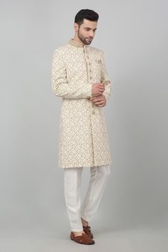 Ivory cotton sherwani with all over floral jaal pattern, metallic gold zardozi embroidery and bead work mandarin collar. Paired with kurta and straight fit pant. - Aza Fashions Designer Gold Sherwani With Chikankari Embroidery, Off White Sherwani With Cutdana, Cream Kurta For Diwali Reception, Cream Sherwani With Pallu, Straight Kurta Style, Eid Cream Sherwani With Straight Kurta, Zardozi Embroidery, Straight Fit Pants, Full Sleeves, Mandarin Collar