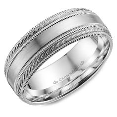 men's wedding band in white gold with intricate engraving on the inside and outside