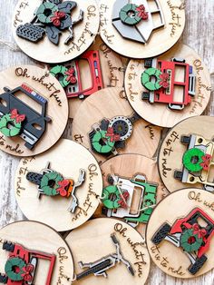 wooden christmas ornament cutouts with holiday decorations on them, sitting on a table