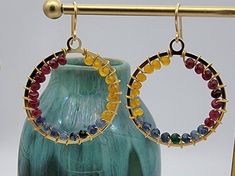 Hoop earrings wire wrapped with gorgeous 3x4mm Agate Rondelle Gemstones. Eye catching ombre pattern. These unique hoops are lightweight and fun to wear. The gold metal hoop frame measures 1 1/2 inches in diameter. The Agate Gemnstones are wire wrapped with 22 gauge, tarnish resistant artistic gold wire.  Handmade Ear Wires Drop length: 1.5 inches Each order comes beautifully wrapped in a gift box with a special thank you gift (bonus jewelry item) included! Orders ship in ONE business day by USPS First Class mail with tracking number provided. Orders totaling $35 or more ship FREE! To check out more of my designs, receive special offers and stay informed when I post new items... **Favorite my Etsy shop https://www.etsy.com/shop/LMichelleDesignsCo **Like my Facebook Page https://www.Facbook. Wrapped Hoop Earrings, Hoop Frame, Ombre Pattern, Ombre Earrings, Earrings Wire, Earrings Beaded, Lightweight Earrings, Beaded Hoop Earrings, Beaded Hoops