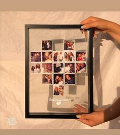 a person holding up a framed photo with many pictures on it and the word love is spelled in small letters