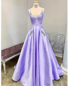 Purple Sleeveless Satin Gown, Spaghetti Strap Gown For Homecoming And Prom, Formal Satin Gown With Spaghetti Straps, Satin Ball Gown For Prom Season Party, Prom Season Satin Ball Gown For Party, Spaghetti Strap Evening Dress For Prom With Satin Finish, Prom Season Satin Ball Gown, Floor-length Satin Ball Gown For Prom, Satin Gown With Spaghetti Straps For Prom