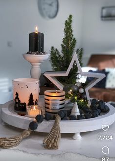 a tray with candles and decorations on it