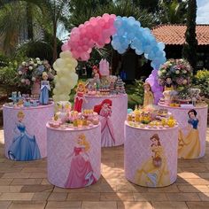 there are many princess themed desserts on the tables at this birthday party with balloons in the shape of princesses