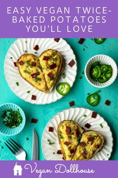 two heart shaped pizzas sitting on top of paper plates