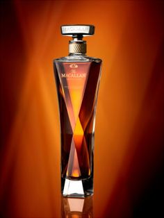 a bottle of macallan is shown on a brown and orange background in this image