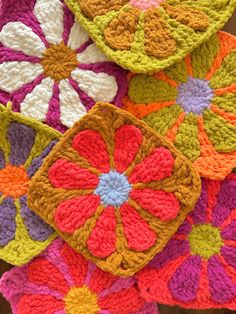 crocheted coasters are arranged on top of each other in different colors and patterns