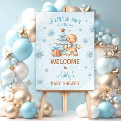 a welcome sign for a baby shower with blue and gold decorations