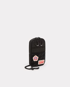 This phone pouch reflects Nigo's passion for retro and military-inspired fashion. It's a practical and distinctive accessory, which features the House's iconic badges on a hook-and-loop panel. We love the adjustable shoulder strap, meaning you can wear it in different ways: around the neck, over the shoulder, cross-body or around the waist.Cross-body phone pouch.Detachable KENZO Paris and KENZO Target badges.Monogram on the hook-and-loop panel.1 interior compartment, 1 flat pocket on the back.Ad Military Inspired Fashion, Kenzo Paris, Retro Mode, Phone Pouch, Moda Vintage, Pin Jewelry, Military Inspired, Mules Shoes, Phone Holder