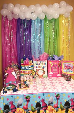 a birthday party with balloons and decorations